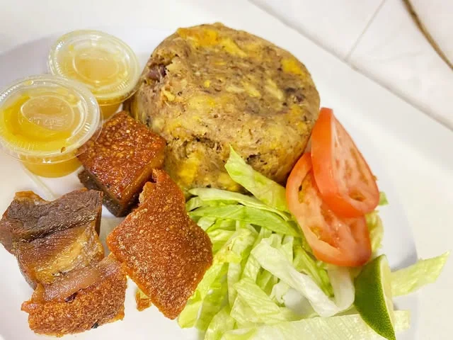 Mofongo with chicharrón, lettuce, tomato and cups of sauce